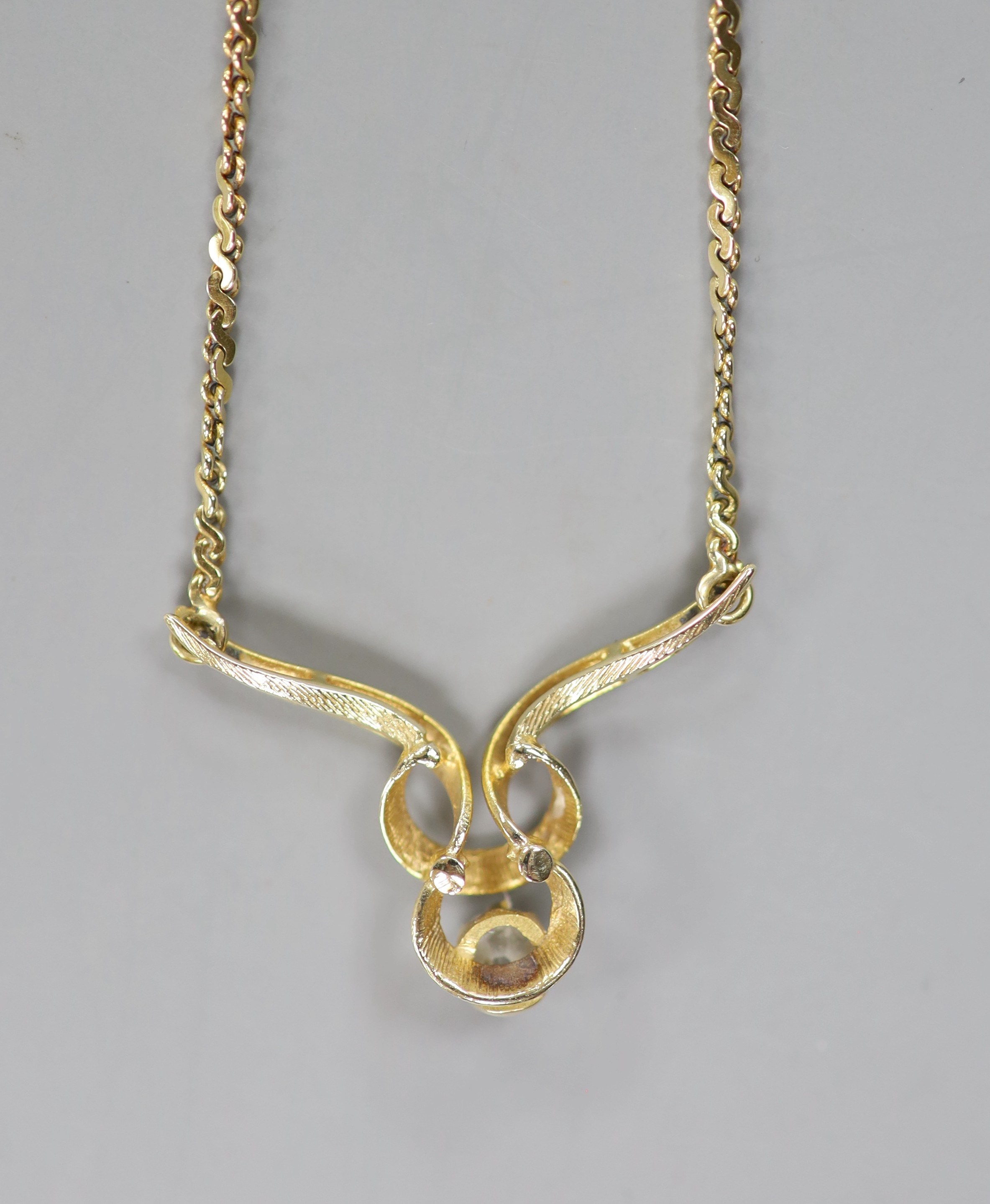 A 9ct gold and diamond pendant necklace, 44cm, gross weight 6.1 grams.